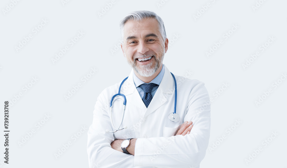 Confident doctor posing and smiling Confident doctor posing and smiling