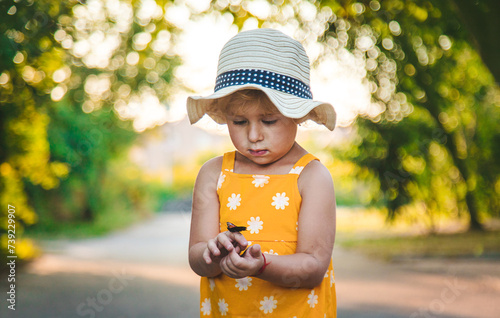 A child catches a butterfly in nature. selective focus.