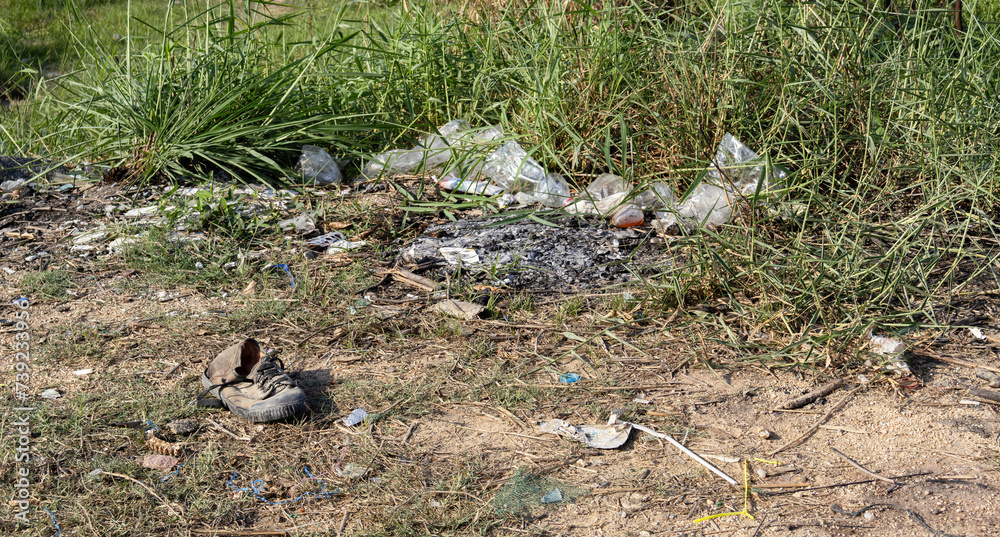 Garbage on the ground, old shoes, environmental protection waste disposal, waste separation, photography Garbage scrap, dirty sand, Background environment Garbage on the ground, old shoes, environmental protection waste disposal, waste separation, photography Garbage scrap, dirty sand, Background environment