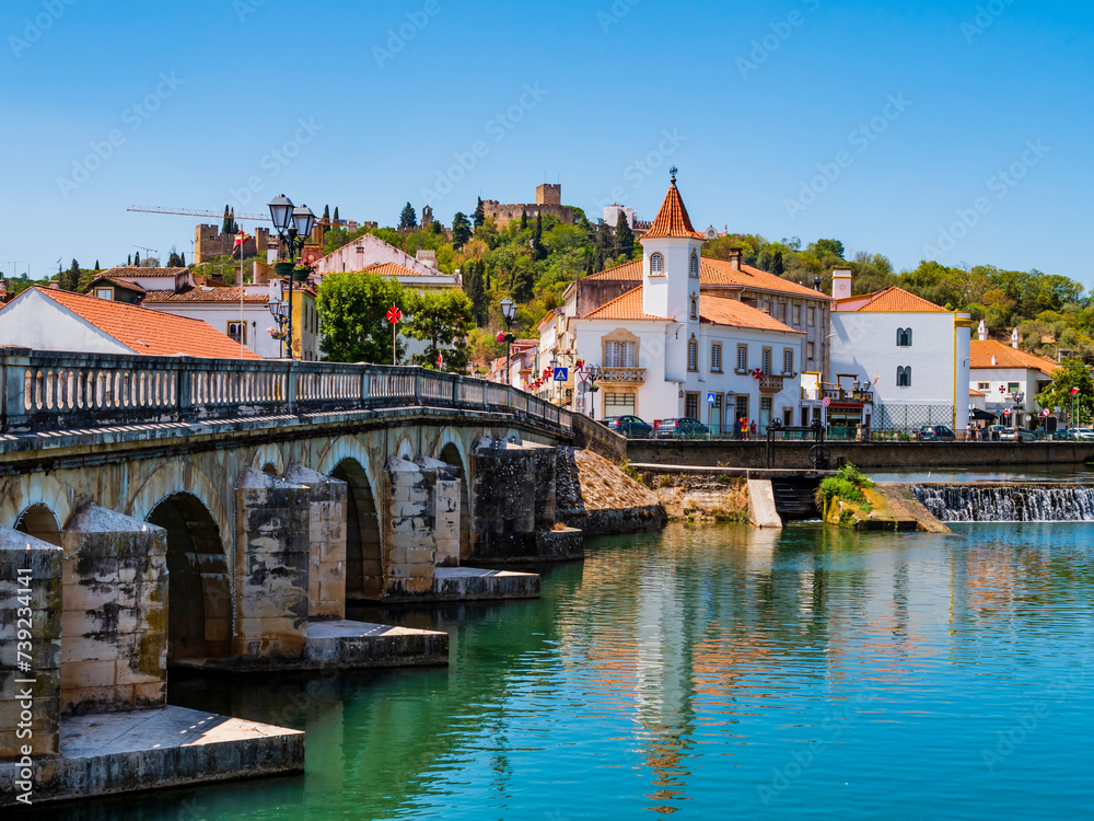 Old bridge (Ponte Vhela) over Nabao river, leading to the historic centre of Tomar, picturesque village in Santarem District, Portugal