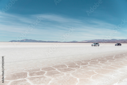 two cars on the Salinas Grandes salt flat. The grandeur of nature photo