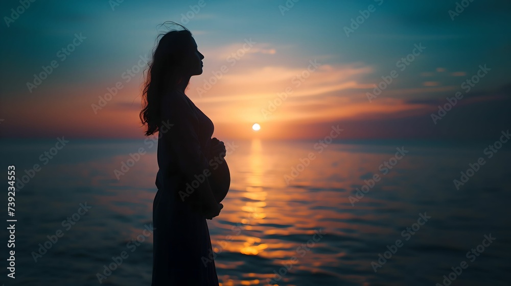 Expectant Mother Silhouette at Ocean Sunset - Tranquil Maternity Image