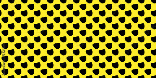 Playful polka dot delight: Seamless vector pattern featuring black freeform dots on a vibrant yellow backdrop. Creative texture of chaotic round shapes and cute triangles. Dotted wrapping paper.