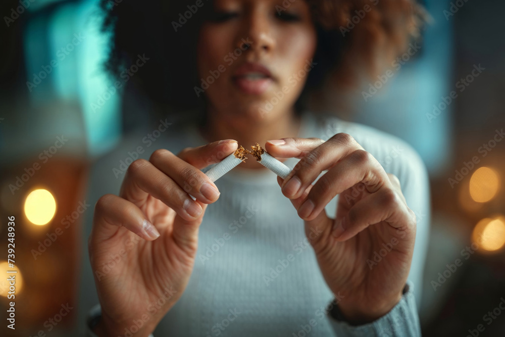 Quit Smoking Concept: Woman Breaking Cigarette in Half - obrazy, fototapety, plakaty 