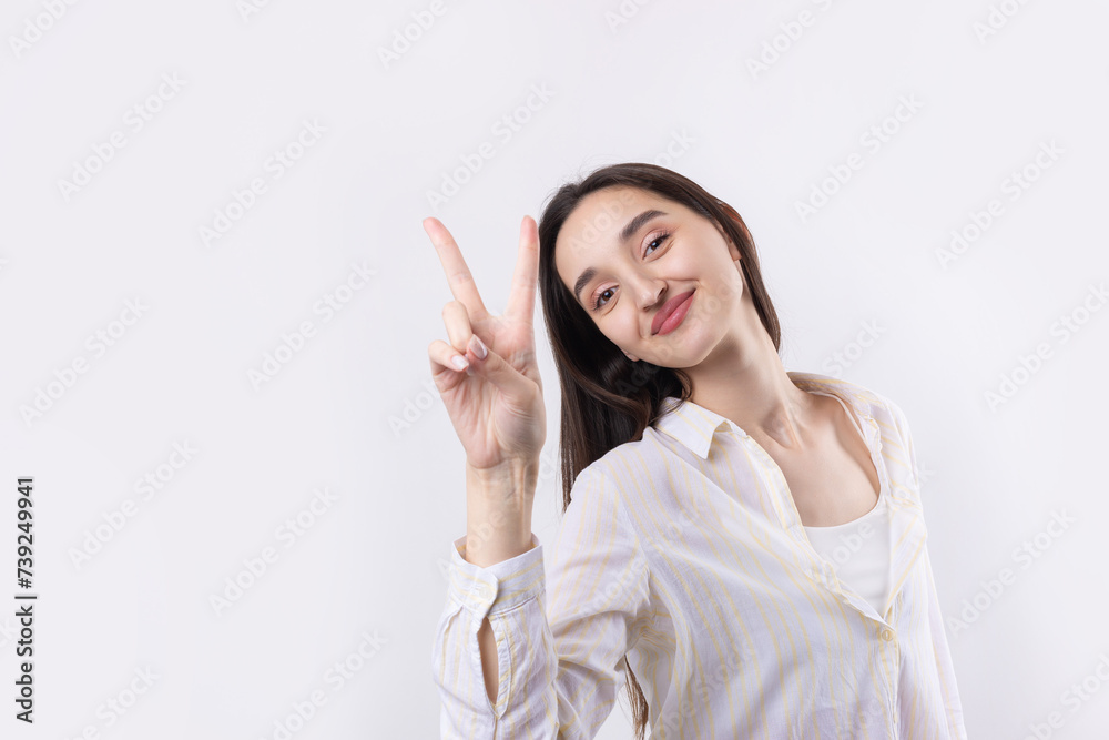 Smiling woman raised her hand palm up and forward like waving. Smiling woman raised her hand palm up and forward like waving.