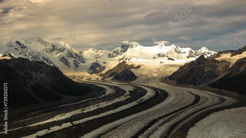 Beautiful aerial view of Root Glacier in Wrangell St. Elias National Park with wispy clouds in the air