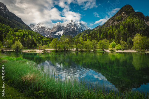 Majestic clean mountain lake and snowy peaks in Slovenia