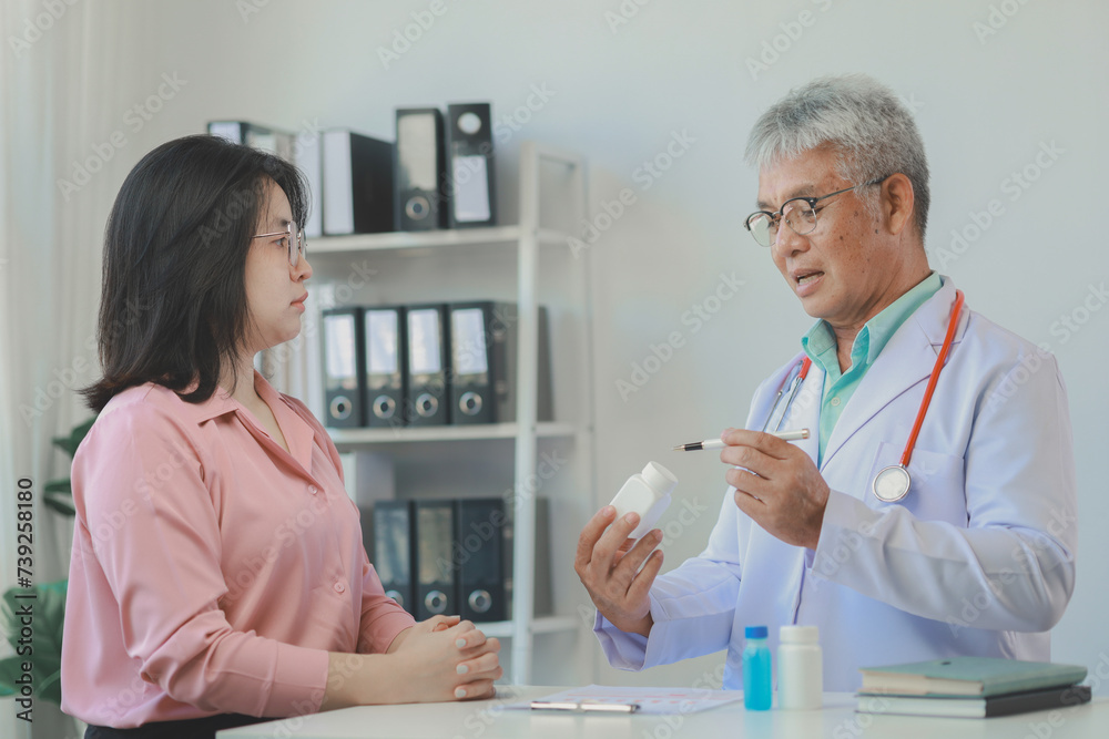 The doctor is explaining the details of the medicine that the patient must take, A patient comes to see the doctor about the problem of side effects from taking medicine.