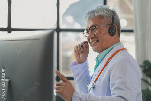A dignified middle-aged male doctor was sitting in his private office at the hospital, Doctors are sitting and working in various poses. at the hospital happily and happily at work