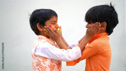 Happy india kids playing holi with water balloon. Holi celebrations in India. photo