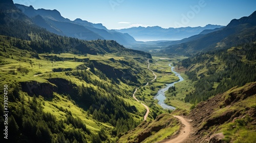 Aerial view of a winding mountain trail, hikers visible in the distance, lush green valleys and rugged terrain, highlighting the beauty of hiking in the mountai