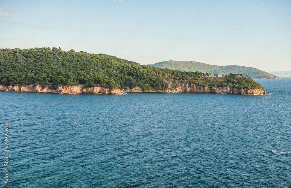 Beautiful sea landscape with forest islands and sky