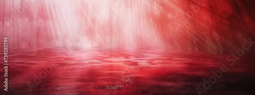 Abstract background with diffused tracks of bright red and white rays against dark blurred surface photo