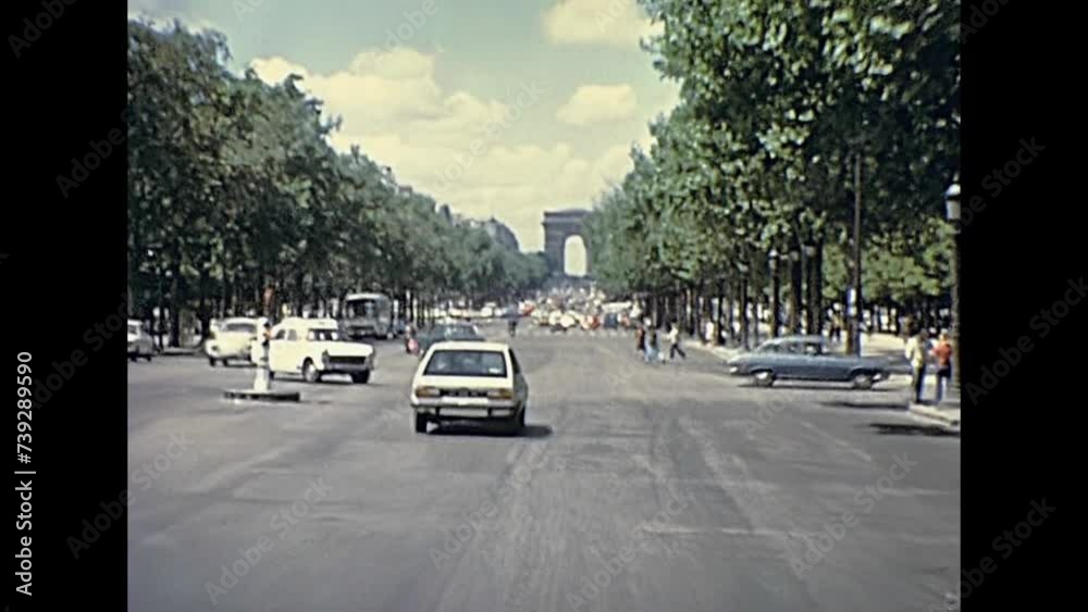 PARIS, FRANCE - CIRCA 1976: Avenue de la Grande Armee to Arch of Triumph. Arc de Triomphe street with car traffic. Historic restored footage on 1970s.