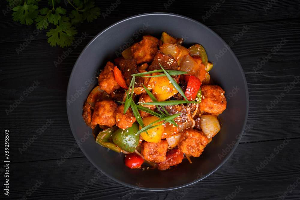 Fototapeta premium Korean food, Tofu with vegetables and meat in sauce on a black background
