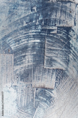 Simple grainy texture of wood in a bluish film negative.