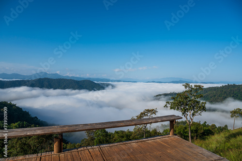 View of forest, mountains and wooden deck with fog in morning at Huai Kub Kab, Chiang mai, Thailand