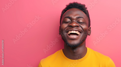 Joyful East African Man, Isolated on Solid Background - Copy Space Included photo
