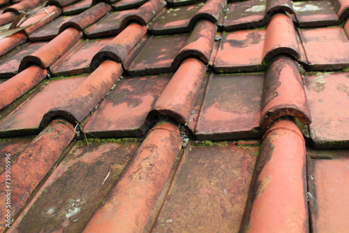 Traditional aged clay roof tile background photo