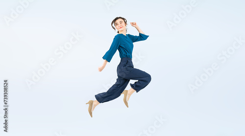 Fototapeta Naklejka Na Ścianę i Meble -  Full body photo of a white woman jumping. (We also sell PNGs that are cropped and have transparent background. Please search for 