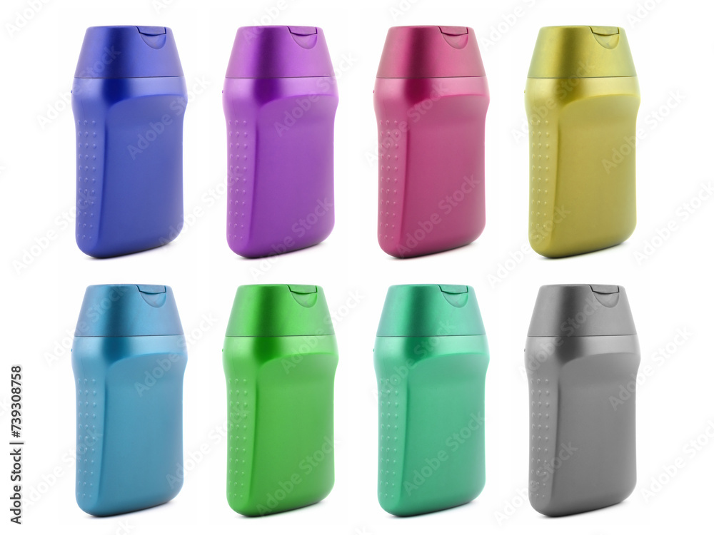 set of multicolored plastic cosmetic bottles, side view closeup on white background