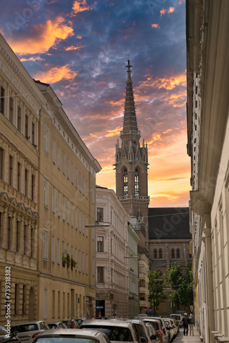the spire of stephansdom seen from a side street at sunset © JorKel