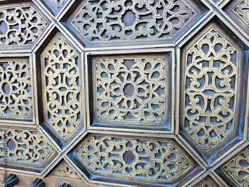 close up details of a traditional Moroccan copper and metal door at the Mohammed V mausoleum in Rabat Morocco
