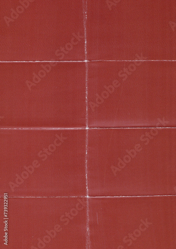 red paper texture with several folding marks, retro paper surface, poster overlay. © Simon