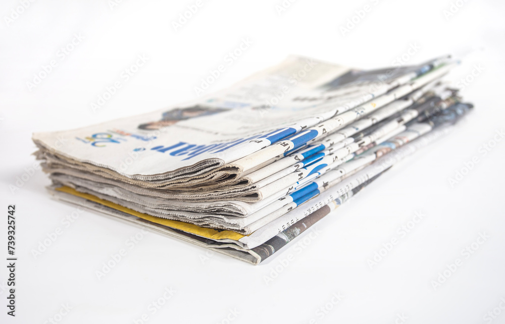 Pile of newspapers isolated on white background. Can be used for illustration or background design. Pile of newspapers isolated on white background. Can be used for illustration or background design.