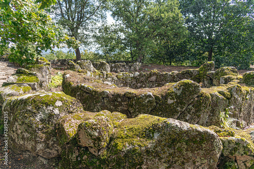 Overview of the ruins of a residential core of the acropolis of the Archaeological site of Citania de Briteiros. Guimarães, Portugal. photo