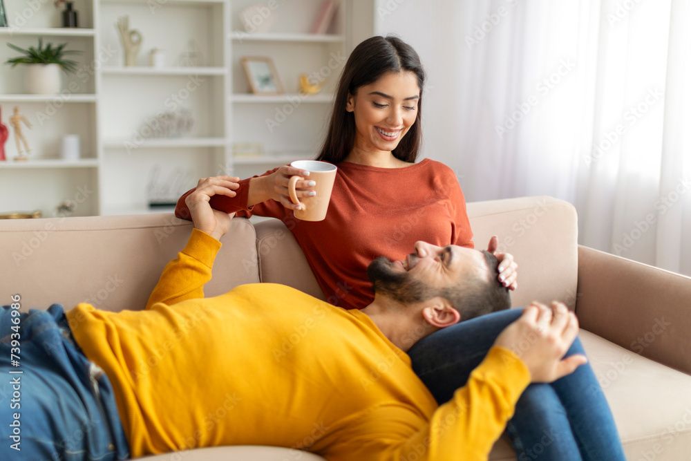 Obraz premium Romantic young couple enjoying time together at home