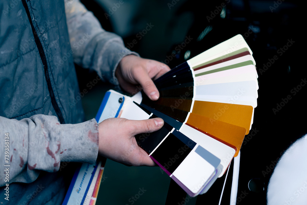 Maintenance Color Work close-up of hand at a service station a master master selects paint ...