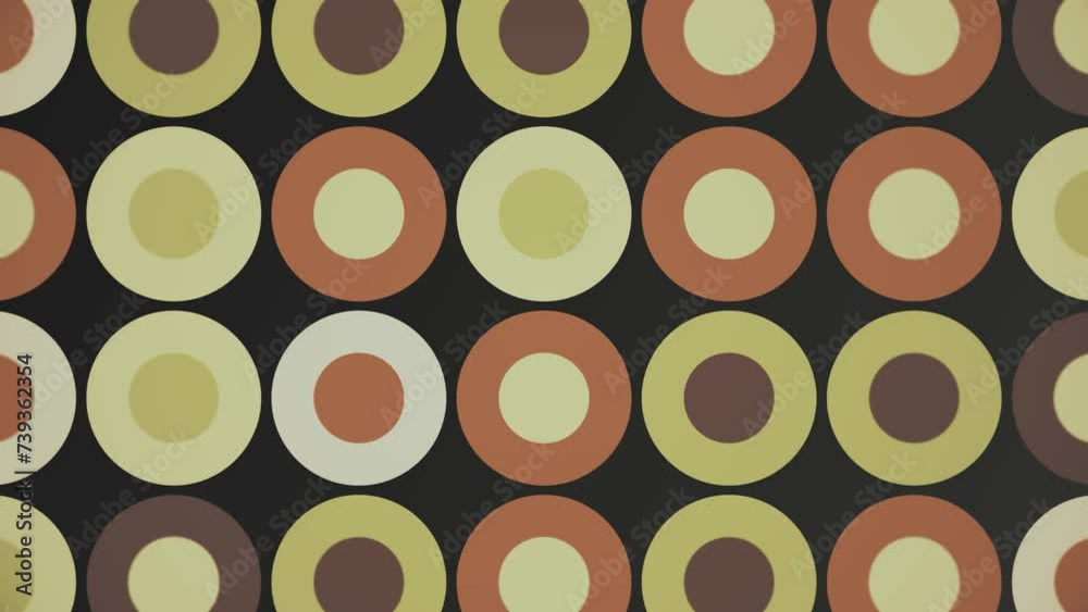 Trendy retro 1970s geometric background with colorful blinking circles in vintage colors - brown, beige and green. This stylish motion background animation is 4K and a seamless loop.
