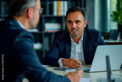 two professional businessmen working or planning in corporate office 