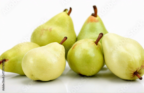 Fresh delicious ripe pears on white background