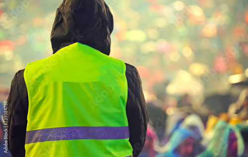 guard with the reflective vest during the event at the stadium