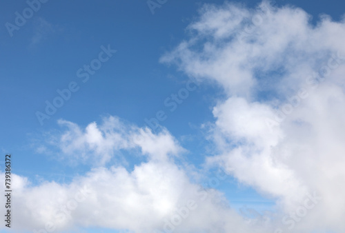 simple natural background with white clouds in the sky and space to write a personalized message