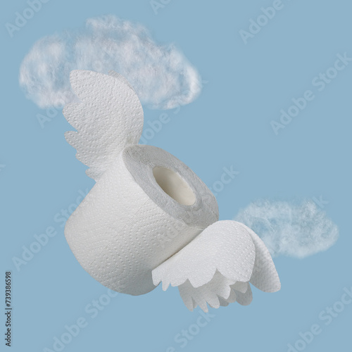 a roll of white toilet paper with wings on a background of cotton wool clouds