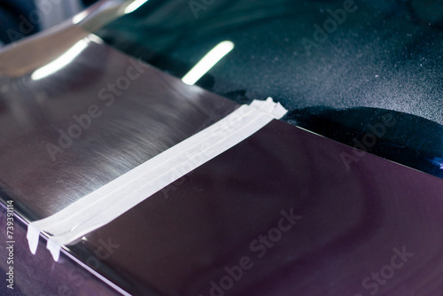 Billede på lærred close-up at a service station a metal part from car has already been polished