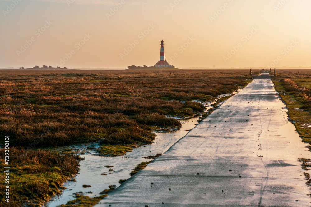 Westerheversand lighthouse on the North Sea a landmark of the Eiderstedt peninsula in Germany.