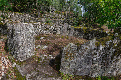 Overview of the ruins of a residential core of the acropolis of the Archaeological site of Citania de Briteiros. Guimarães, Portugal. photo