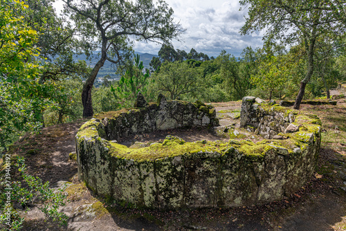 Overview of the ruins of a residential core of the acropolis of the Archaeological site of Citania de Briteiros. Guimarães, Portugal. photo