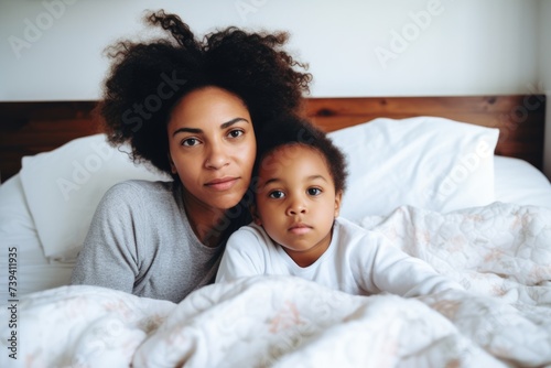 African American mother and child sharing a peaceful moment in bed. Gentle Embrace - Mother and Child Together