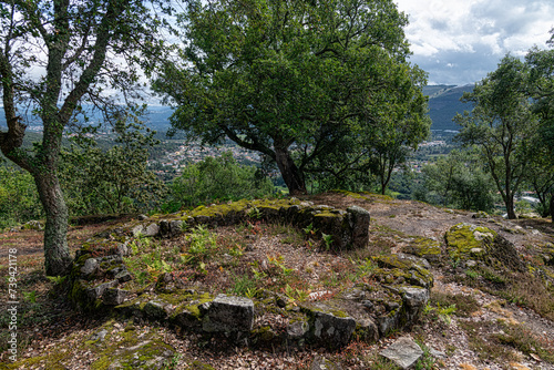Overview of the ruins of a residential core of the acropolis of the Archaeological site of Citania de Briteiros. Guimarães, Portugal. photo