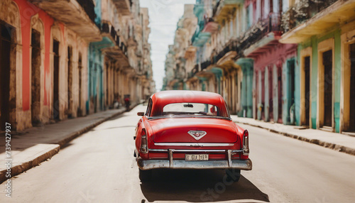 retro red car on a sunny street in havana  cuba 