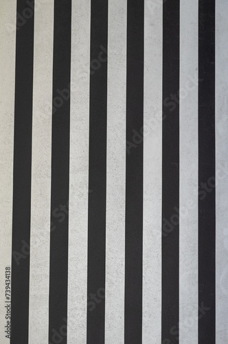 Vertical White and Black Parallel Lines on a Building Wall.