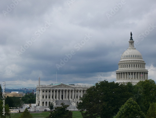 The United States Capitol in Washington, D.C., on a cloudy day. This neoclassical landmark houses the U.S. Congress and is a symbol of American democracy and government.