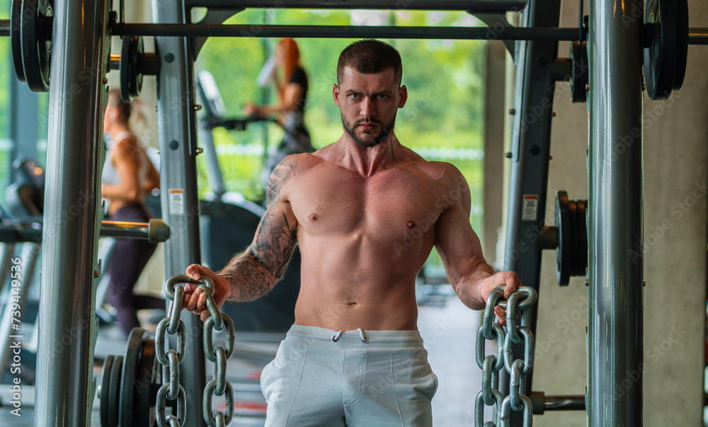 Fit guy doing exercise at gym. Handsome sporty man workout with with dumbbells on gym. Male athlete with dumbbell on fitness workout. Fitness man in gym. Muscular sportsman workout with weight in gym. Fit guy doing exercise at gym. Handsome sporty man workout with with dumbbells on gym. Male athlete with dumbbell on fitness workout. Fitness man in gym. Muscular sportsman workout with weight in gym.