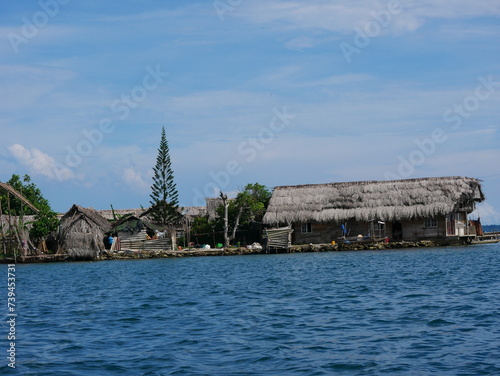indigenous straw houses (original peoples) on a Caribbean island, Guna Yala territory (San Blas Islands, Panama) photo