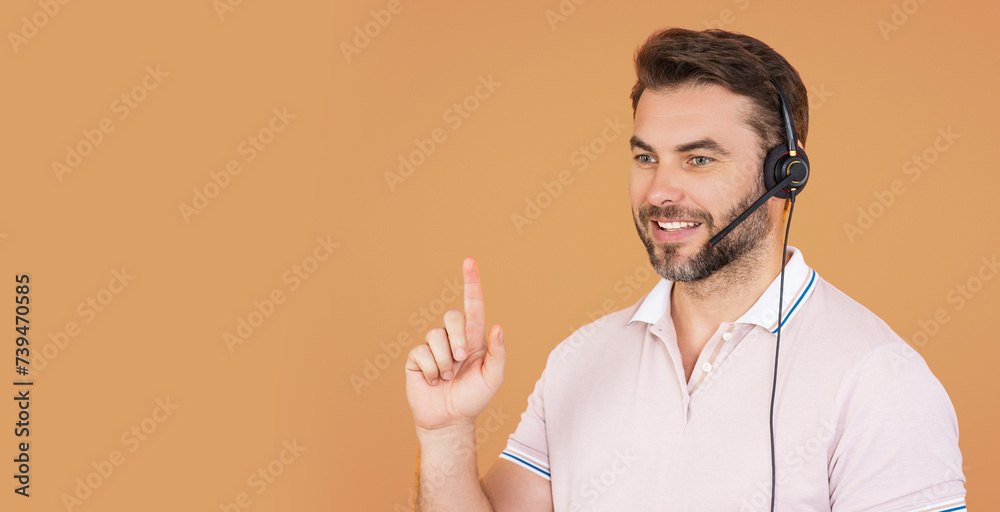 Banner of customer service representative wearing a headset isolated on beige. The Call center. Portrait of man with headset. Customer support operator. Technical support. Call center operator. Banner of customer service representative wearing a headset isolated on beige. The Call center. Portrait of man with headset. Customer support operator. Technical support. Call center operator.